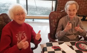 Waterville resident holding friends hand.